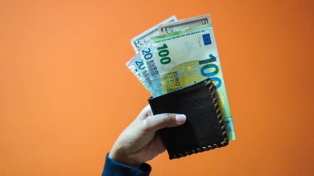 a Hand holding a wallet stock photo