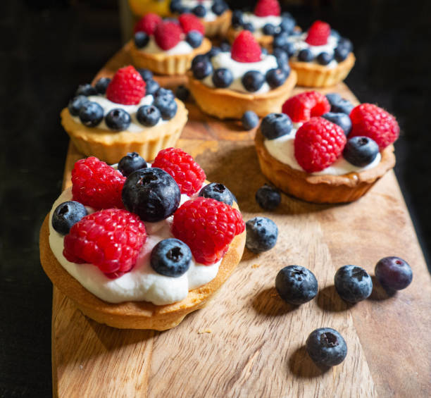 istock Freshly baked baskets with curd cream and strawberries 1462614505