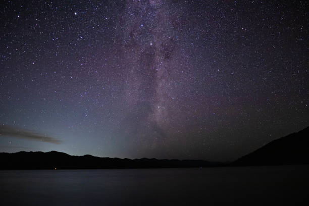 istock Starry Night Sky over Ocean with Milky Way Galaxy 1462631469