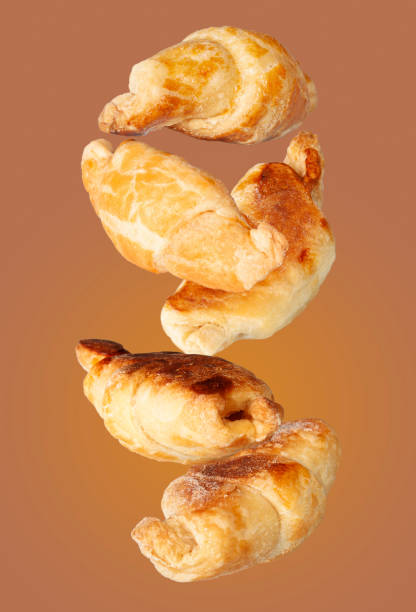 istock mini croissants fly on a white background 1462635282
