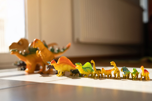 Dinosaur toys in a row
