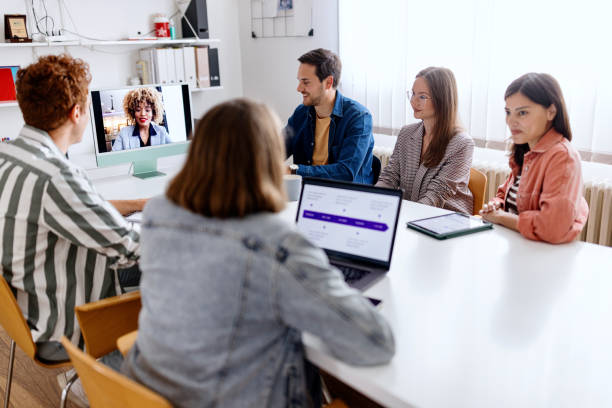 istock Coworkers attending a video call 1462635328