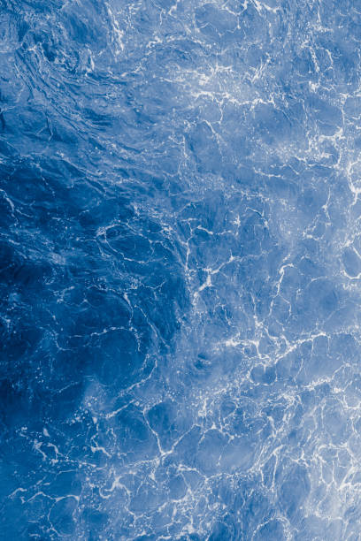 istock Blue purple sea surface with waves, splash and bubbles 1462635962