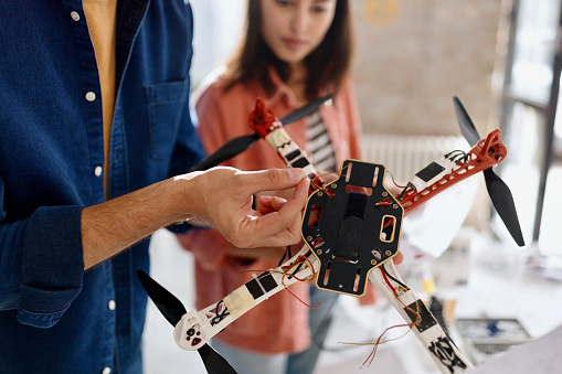 Close-up photography of young people making a drone project