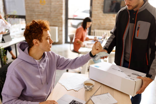 istock Paying order with smartwatch to delivery guy 1462638239