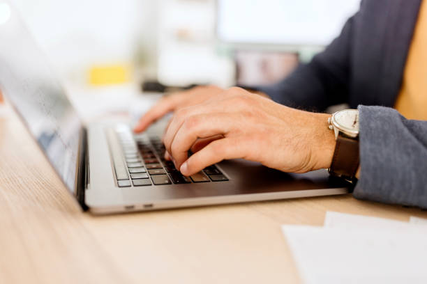 istock Close up of man working on his laptop 1462640430
