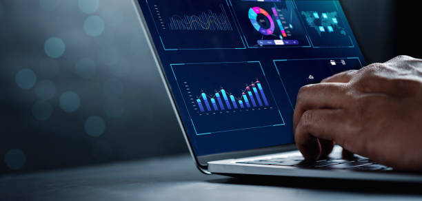 analyst working with computer in business analytics and data management system to make report with kpi and metrics connected to database. corporate strategy for finance, operations, sales, marketing. - analyzing imagens e fotografias de stock