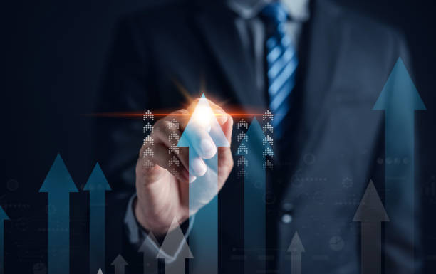 istock Growth arrows increase planning business target chart to successful. Businessman touching arrows analyst to leadership objective goal. Corporate strategy for finance, operations, sales, marketing. 1462652388