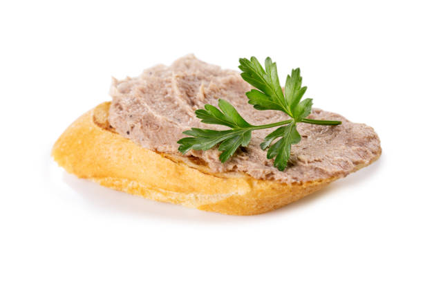 istock Meat pate on baguette with parsley, close-up 1462654956