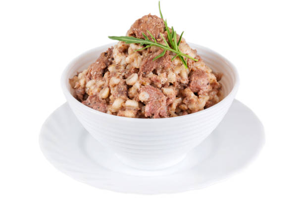 istock Canned pearl porridge with meat and arugula 1462654957