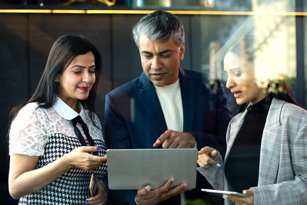 istock Business people with laptop at office 1462654986