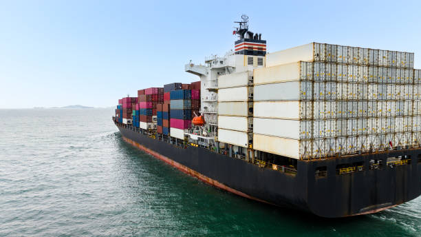 istock cargo container ship sailing in sea to import export goods and distributing products to dealer and consumers across worldwide, by container ship Transport business service.4k video 1462655050