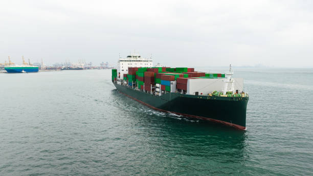 istock cargo container ship sailing in sea to import export goods and distributing products to dealer and consumers across worldwide, by container ship Transport business service.4k video 1462655070