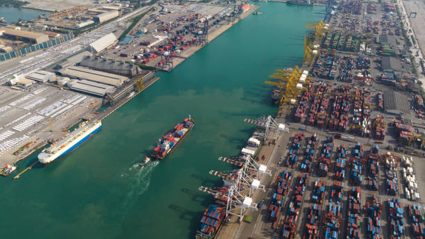 istock container ship and commercial port load and unloading cargo from container ship by crane to trailers transported aerial view 1462655072