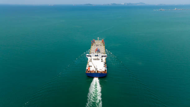 istock cargo container ship sailing in sea to import export goods and distributing products to dealer and consumers across worldwide, by container ship Transport business service.4k video 1462655107