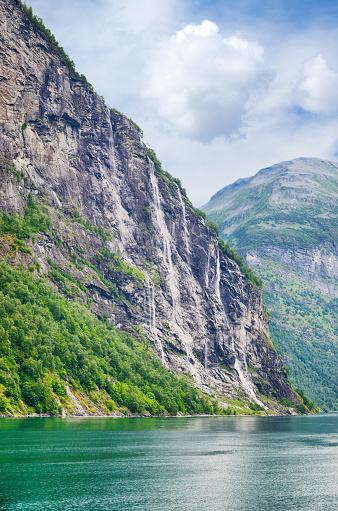 The waterfall consists of seven separate streams located along the Geirangerfjorden, it is the 39th tallest waterfall in Norway.