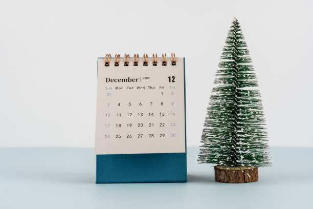 istock December 2023 desk calendar with small pine tree 1462655542