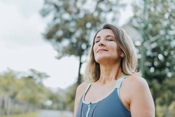 Portrait of a woman breathing fresh air stock photo