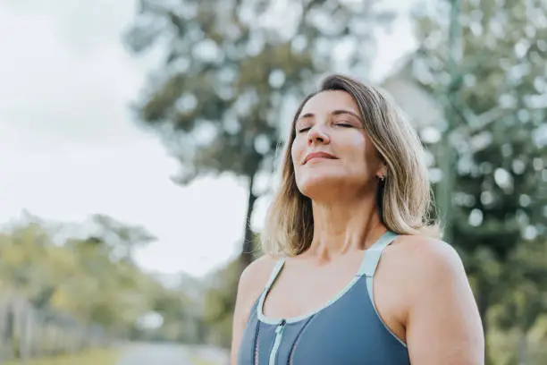 Portrait of a woman breathing fresh air