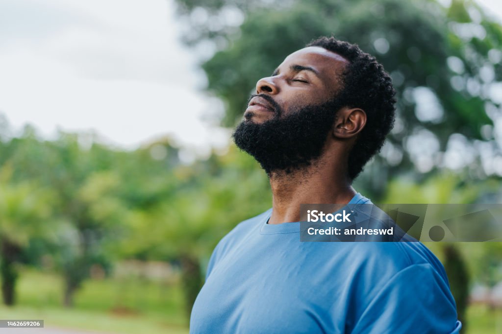 Portrait of a man breathing fresh air in nature Men Stock Photo