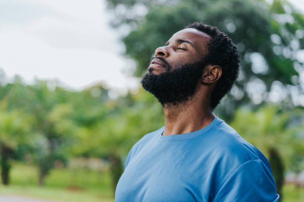 Portrait of a man breathing fresh air in nature stock photo
