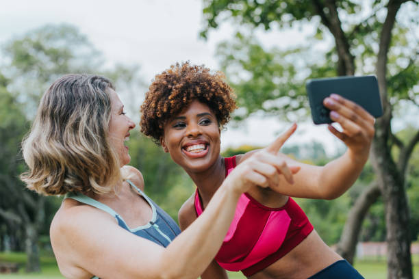 istock Two female friends taking selfie during exercise break 1462659645