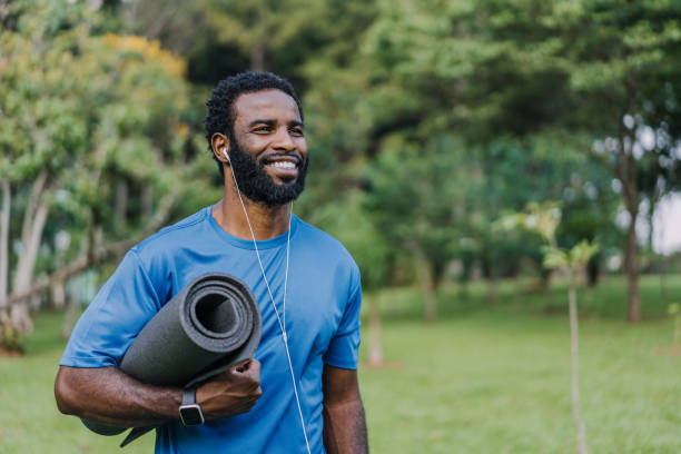 istock Portrait of a man going to exercise holding exercise mat 1462659721