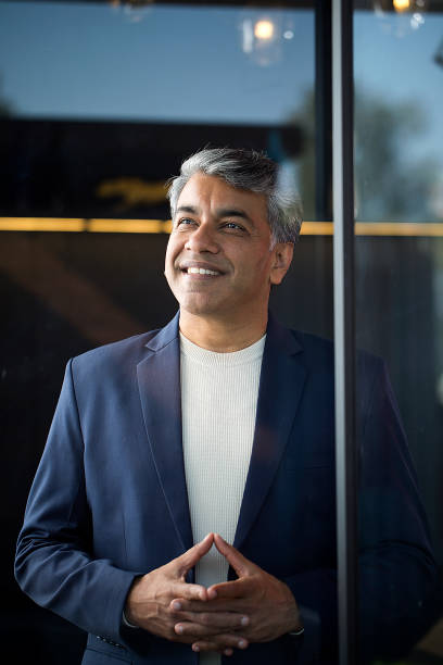 istock Businessman smiling with his hands clasped 1462660144