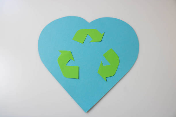 istock Eco-concept with a waste recycling symbol on a blue heart background 1462662077
