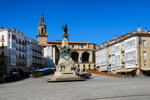 Vitoria Gasteiz, Spain - August 23, 2022: Tourists walking through the Virgen Blanca square on a summer day.