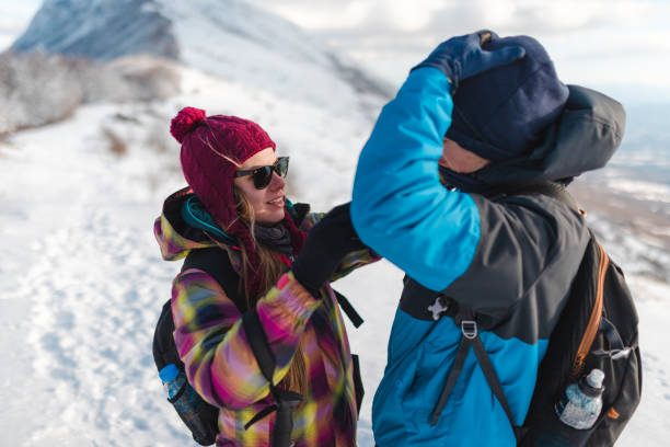 istock Two friends hiking outdoors adjusting their equipment 1462663097