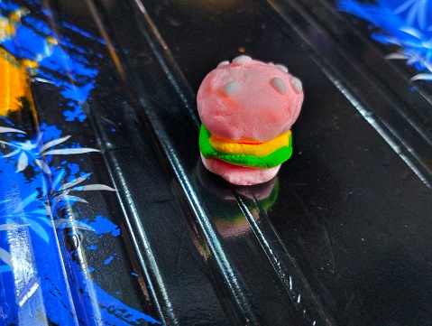 Clay art in the shape of a burger cartoon