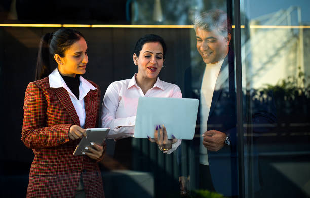 istock Business people with laptop and digital tablet at office 1462665971