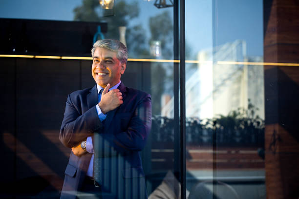 istock Thoughtful businessman looking away at office 1462666140