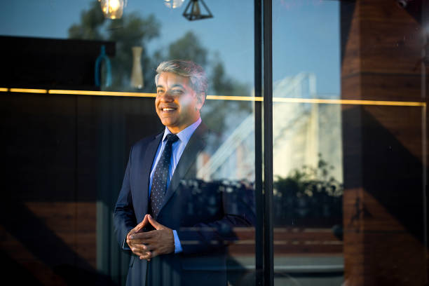 istock Businessman smiling with his hands clasped 1462666400