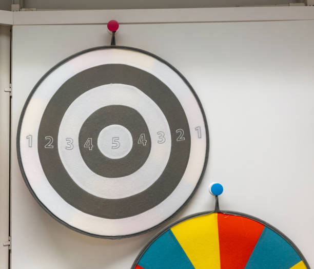 istock Childrens game target Velcro, darts and balls hanging on white background. 1462667789