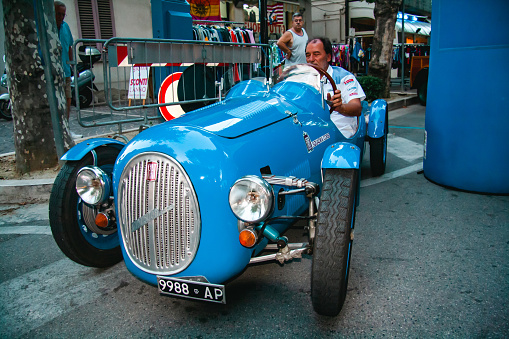 Giulianova, Teramo, Italy - July 31, 2012: Vintage cars at an outdoor event in Giulianova, Teramo.. An italian blue Fiat 500A Barchetta at an event for car collectors.
A man driving a vintage Fiat 500 A Barchetta