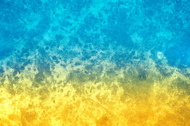 istock Grunge concrete wall with blue yellow gradient color 1462674207