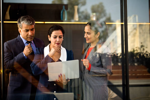 istock Business people discussing using laptop at office 1462675384