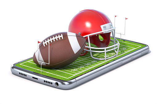 American football app video game on smartphone.. Mobile phone and american football ball and helmet isolated on white. 3d illustration