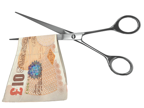 British pound money financial crisis scissors
