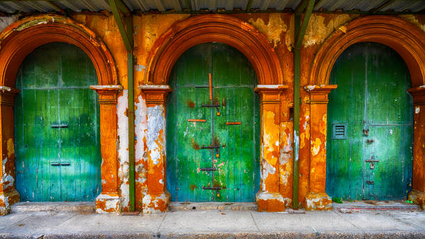 Old Door In Cartagena Colombia Old Doors In Cartagena Colombia's Walled City cartagena colombia stock pictures, royalty-free photos & images