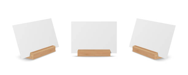 istock Vector 3d Realistic White Empty Blank Paper Sheet, Card on Wooden Holder, Stand Icon Set Closeup Isolated. Design Template for Mockup, Menu Frame, Booklets. Acrylic Tent Card. Front, Side View 1462682896