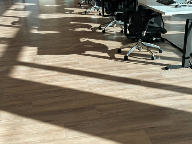 Sunlight shining on floor of empty room through sliding doors, Hong Kong, China.