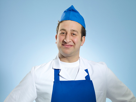 Portrait of a young baker in uniform