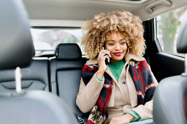 istock A woman talking on her smartphone in the car 1462688912