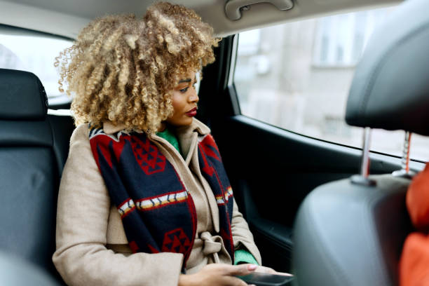 istock African woman looking out the car window 1462689082