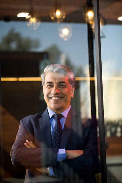 istock Businessman looking away through glass window 1462699367