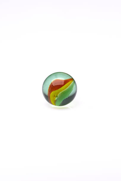 istock Colored glass marbles ball on white background 1462700453