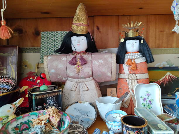 Miscellaneous collected travel souvenirs in a granny's cupboard.